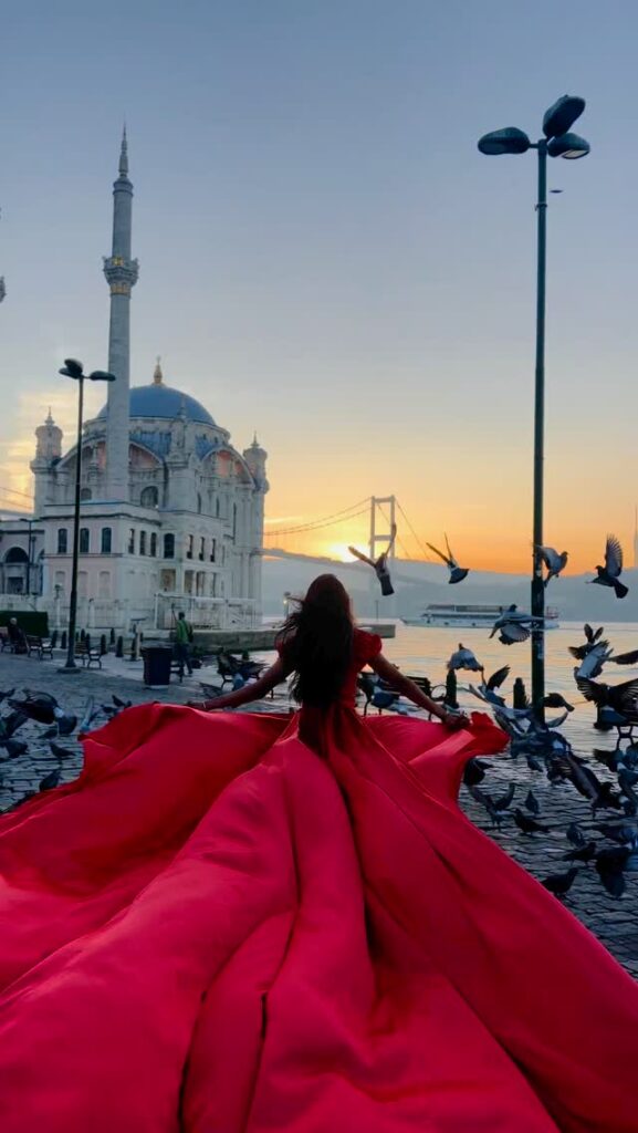 Professional photoshoot with flying dress in Istanbul in front of the Ortakoy mosque